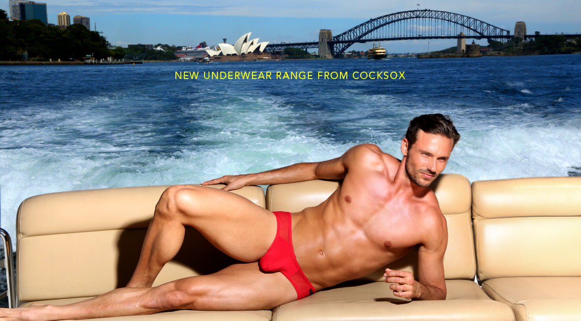 Lifestyle editorial image of the Cocksox CX75 Mesh Underwear Sports Brief in Emperor Red
